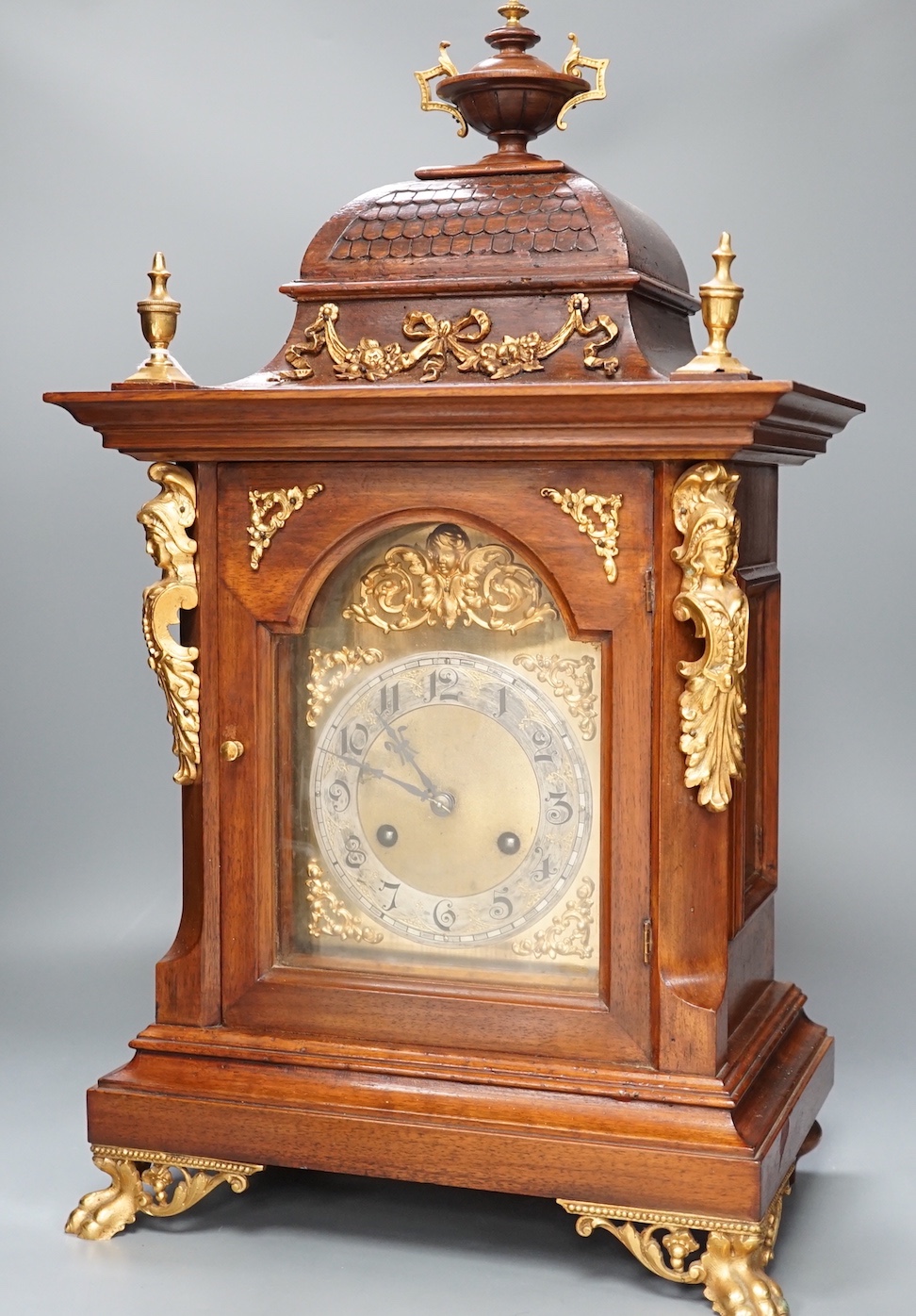 A reproduction gilt metal mounted bracket clock, 55cm
